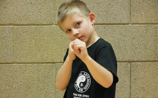 Kick Boxing - Fighting stance and guard from kick boxing, showing elbows protecting ribs and side profile to minimise target areas to opponent