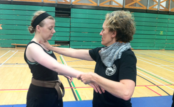 Defending throat and wrist grab